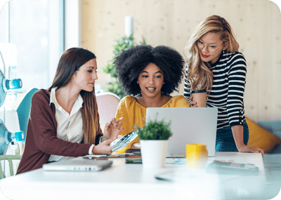 diverse-team-collaborating-around-laptop